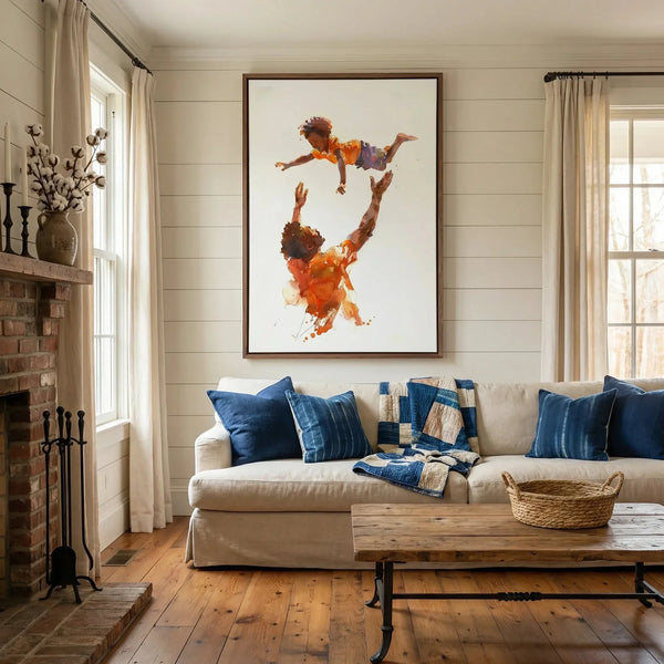 Black father and son art in a farmhouse living room, watercolor dad tossing his boy above a sofa with indigo pillows