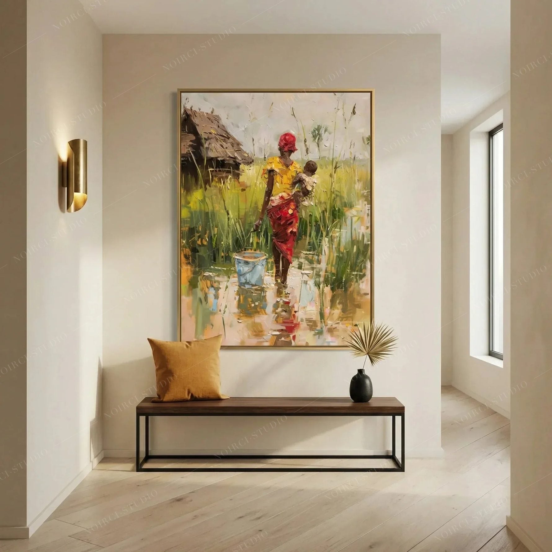 African art canvas print of a mother and baby in a bright entryway above a walnut bench with a mustard pillow