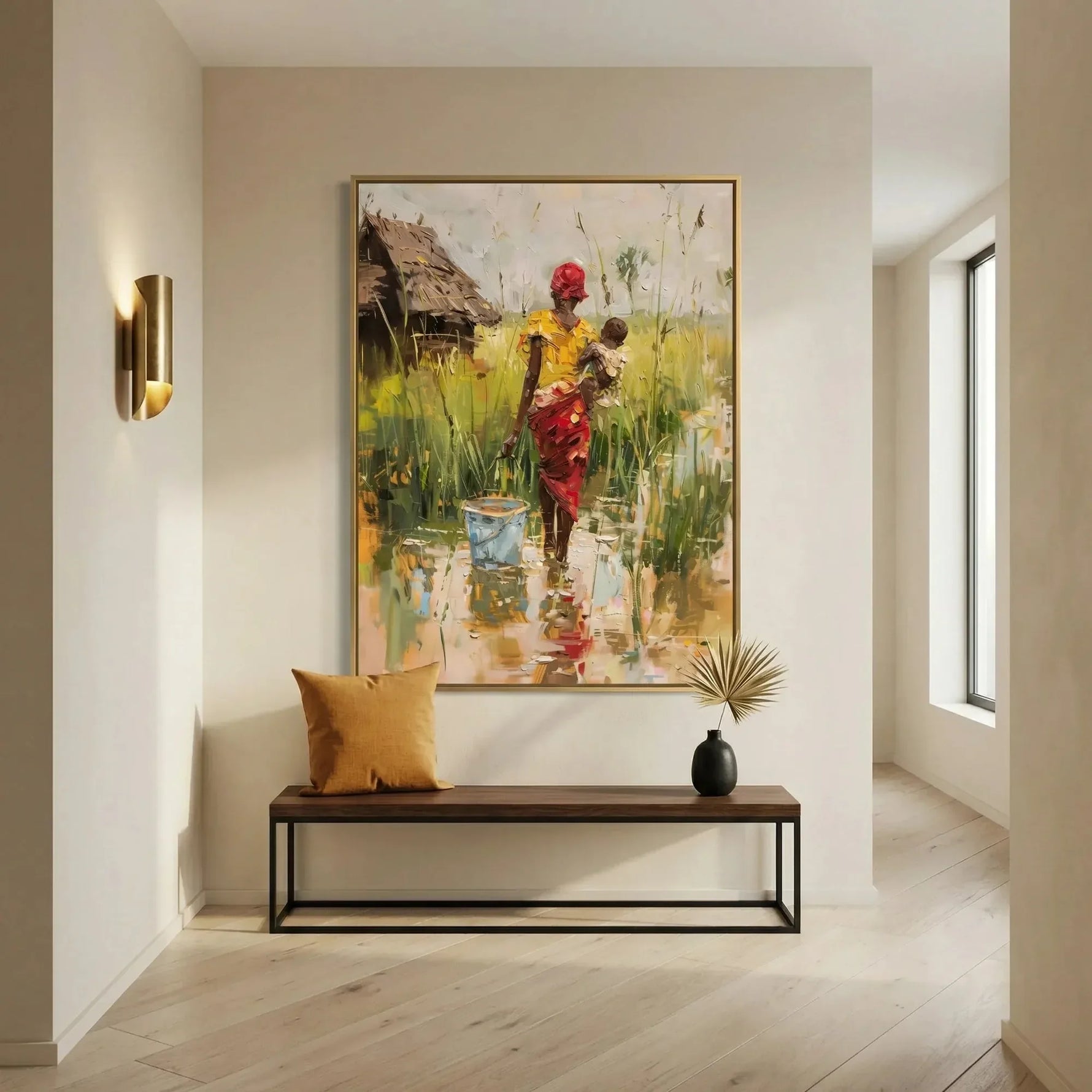 African art canvas print of a mother and baby in a bright entryway above a walnut bench with a mustard pillow