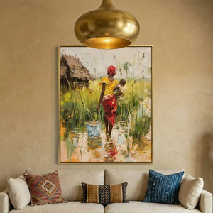 Black art for living room, mother and baby village canvas above a cream sofa with patterned pillows