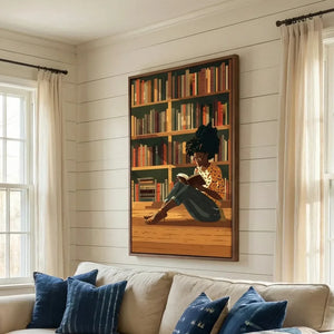 Black art for living room, girl reading canvas above a cream sofa with indigo pillows on a shiplap wall