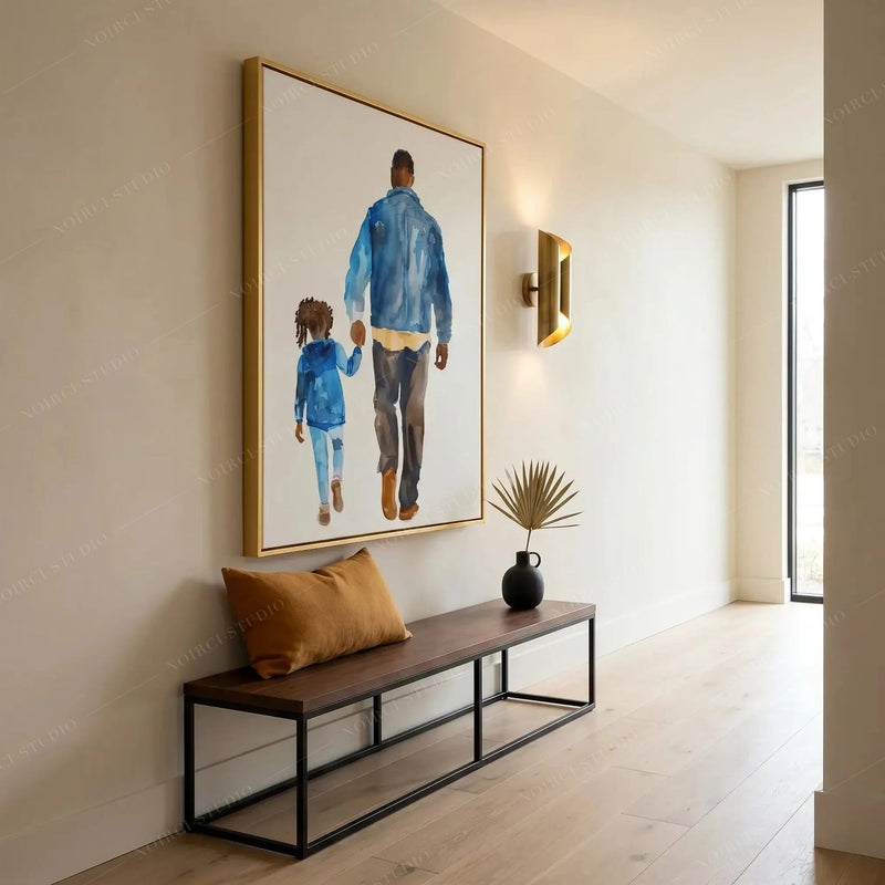 Modern Black art for an apartment hallway, gold framed print above a low bench with a mustard linen cushion