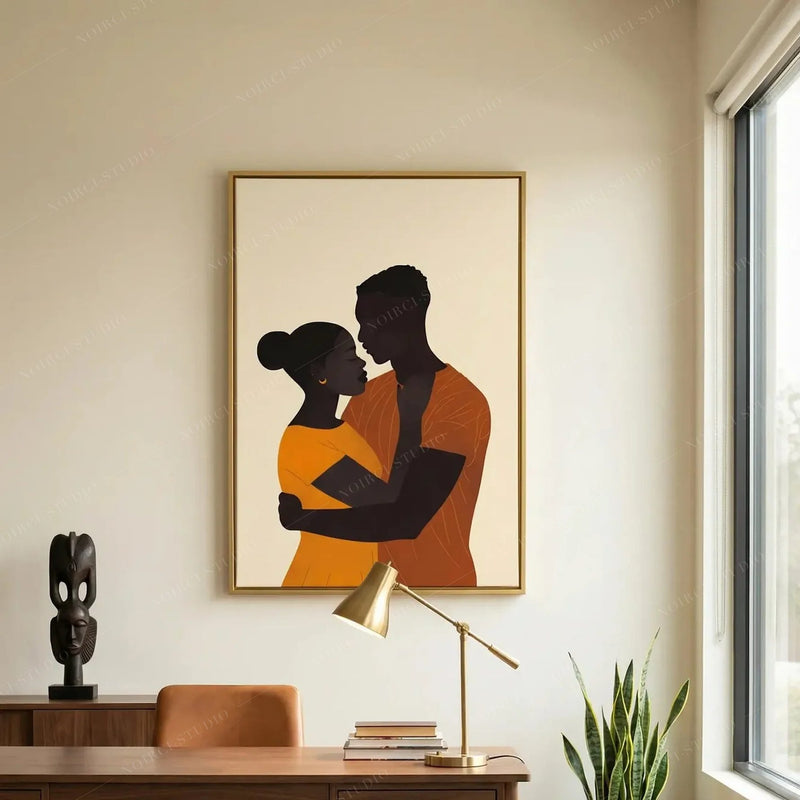 African American art for a home office, gold-framed couple embrace above a walnut desk and carved ebony statue