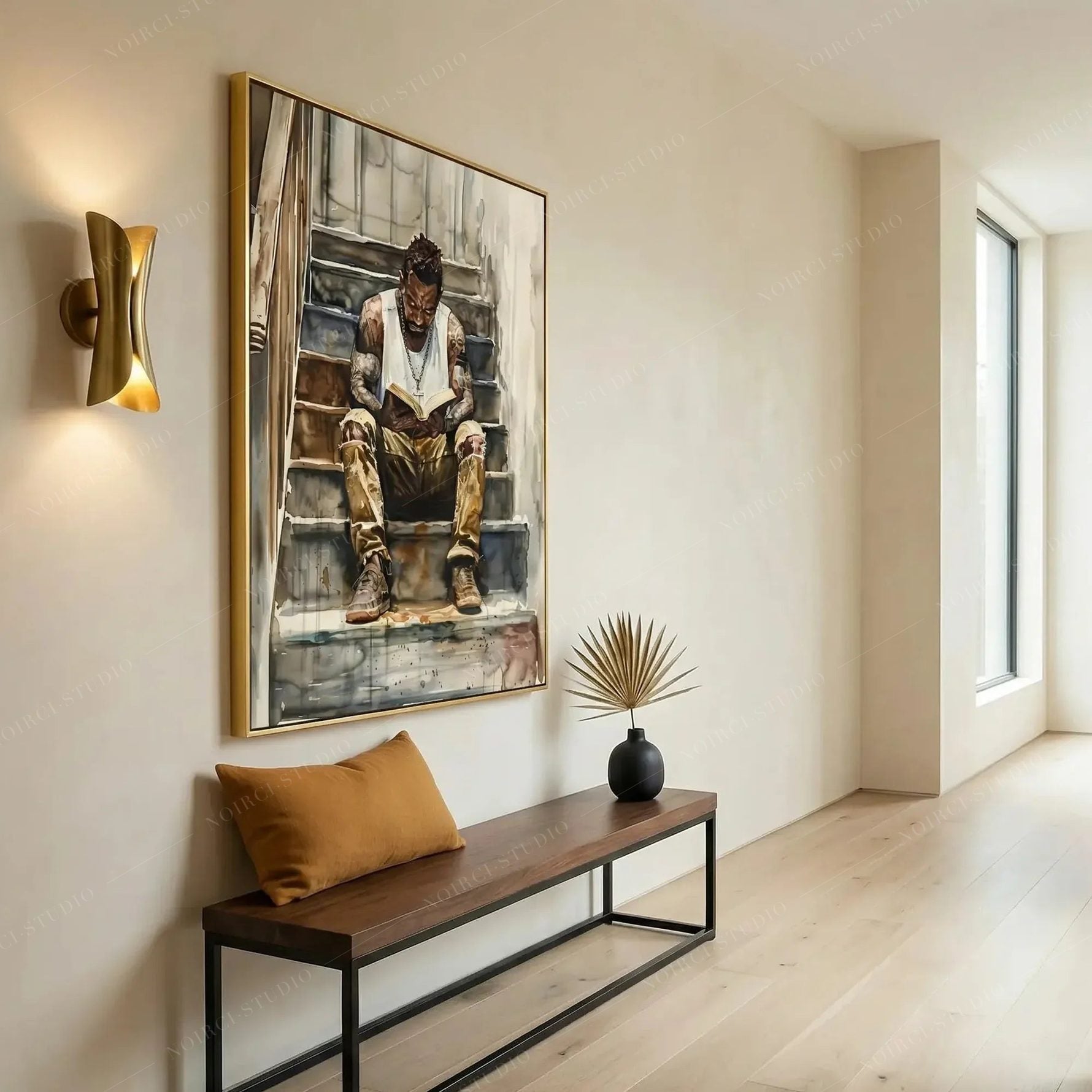 Modern Black art for apartment in a hallway with gold sconce, walnut bench and dried palm, man reading watercolor