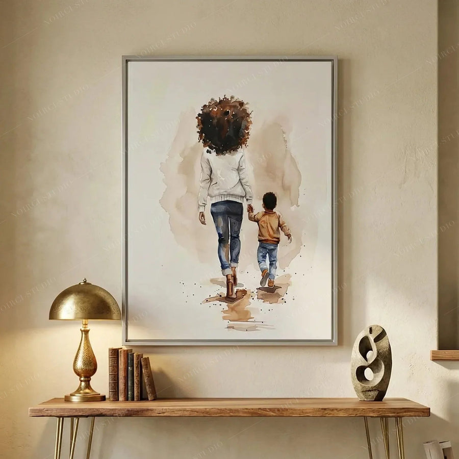 African American hallway art above a wood console with brass lamp and books, mother and son walking watercolor