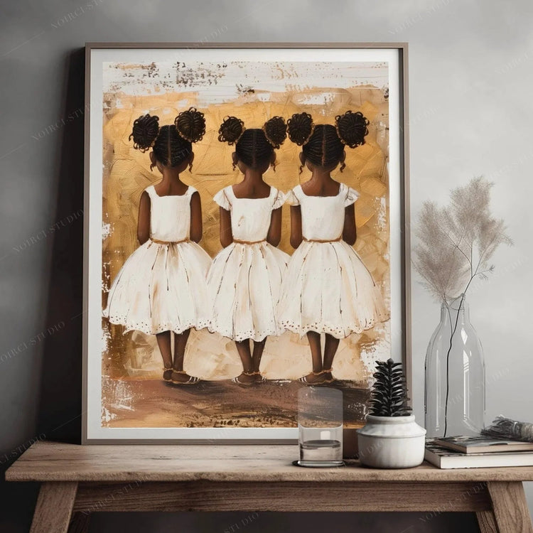 Black family art of three little sisters in white dresses, gold-toned painting styled on a wood bench with dried stems
