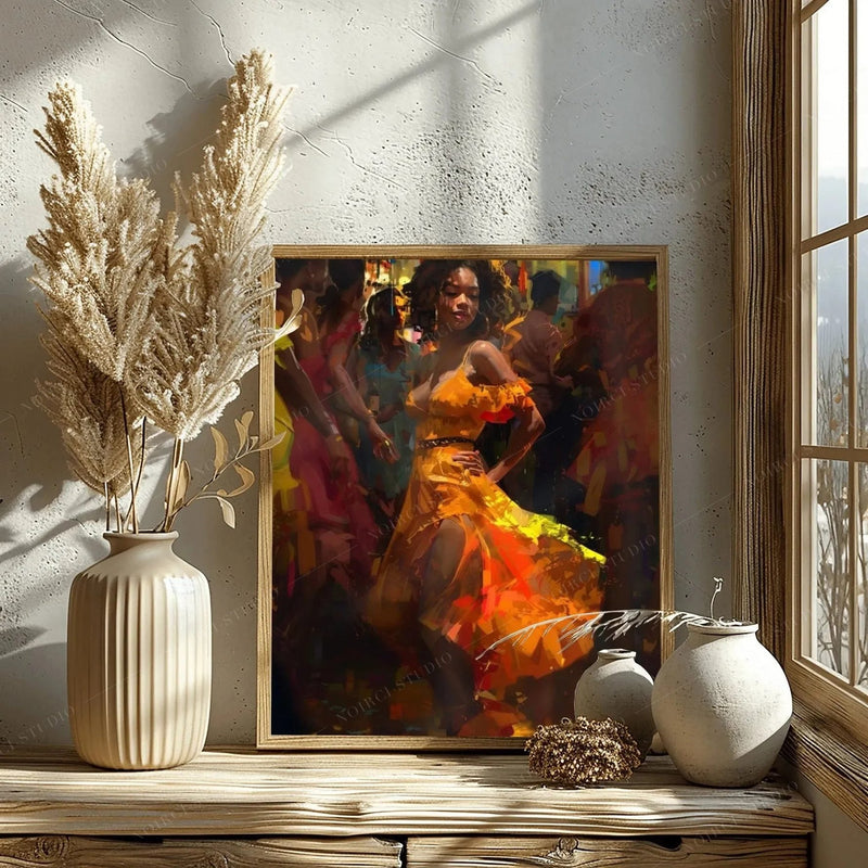 Framed salsa dance print leaning on a rustic wood sill beside pampas grass in warm window light