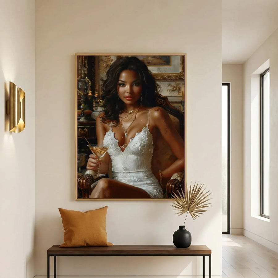 African American wall decor above an entryway bench with a mustard pillow, brass sconces, and dried palm in a black vase