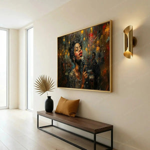 Modern Black art for an apartment entryway, gold framed jazz singer above a walnut bench with a camel pillow