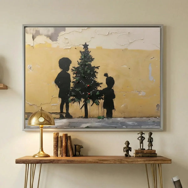 Black family Christmas art in a gray frame above a console with a brass lamp and African statues, kids decorating a tree