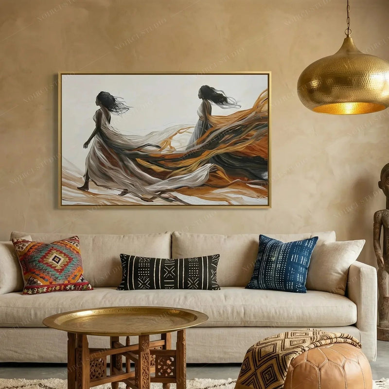 Afrohemian decor, flowing gowns canvas above a cream sofa with kilim pillows under a hammered gold pendant