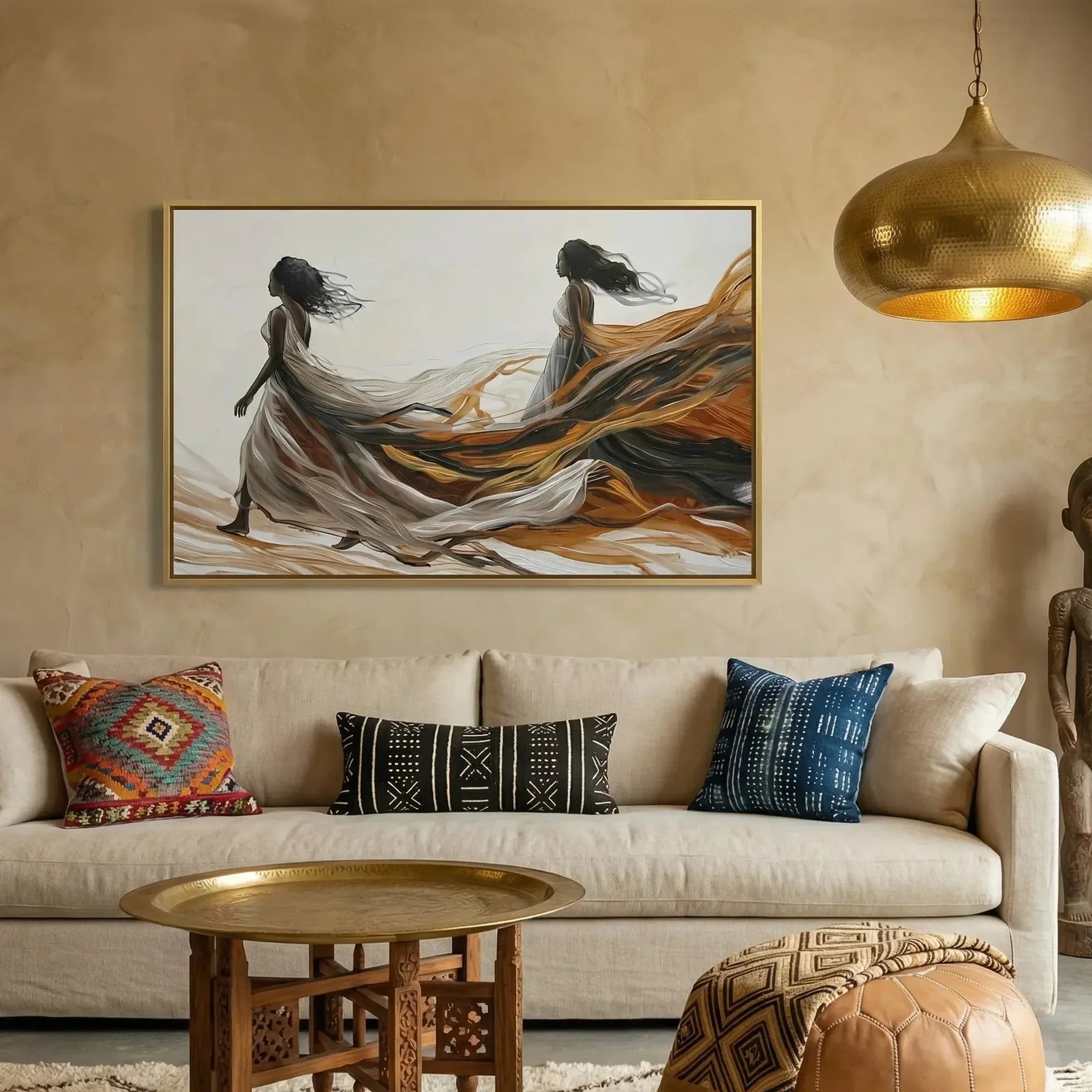 Afrohemian decor, flowing gowns canvas above a cream sofa with kilim pillows under a hammered gold pendant