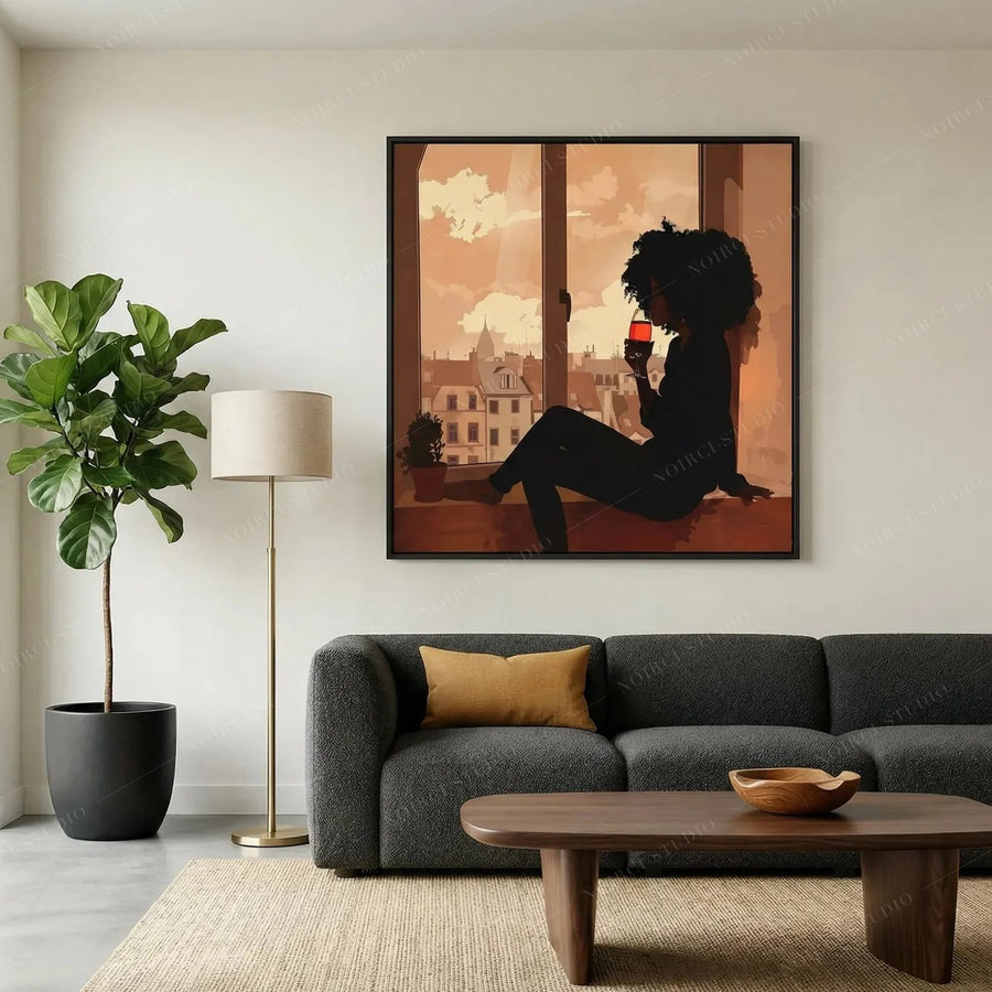 Black art for living room, framed woman with wine above a charcoal sofa with fiddle leaf fig and wood coffee table