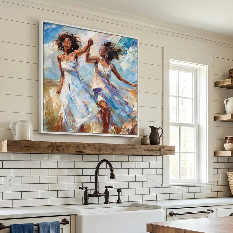 Black kitchen wall art above a farmhouse subway tile backsplash and wood shelf, women dancing in white sundresses