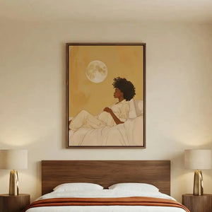 African American art for the bedroom, moon maternity canvas above a walnut platform bed with an orange throw