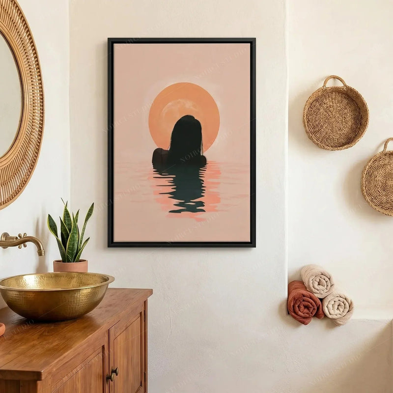 African American bathroom art, woman at sunrise in a dark frame above a brass basin and rattan mirror