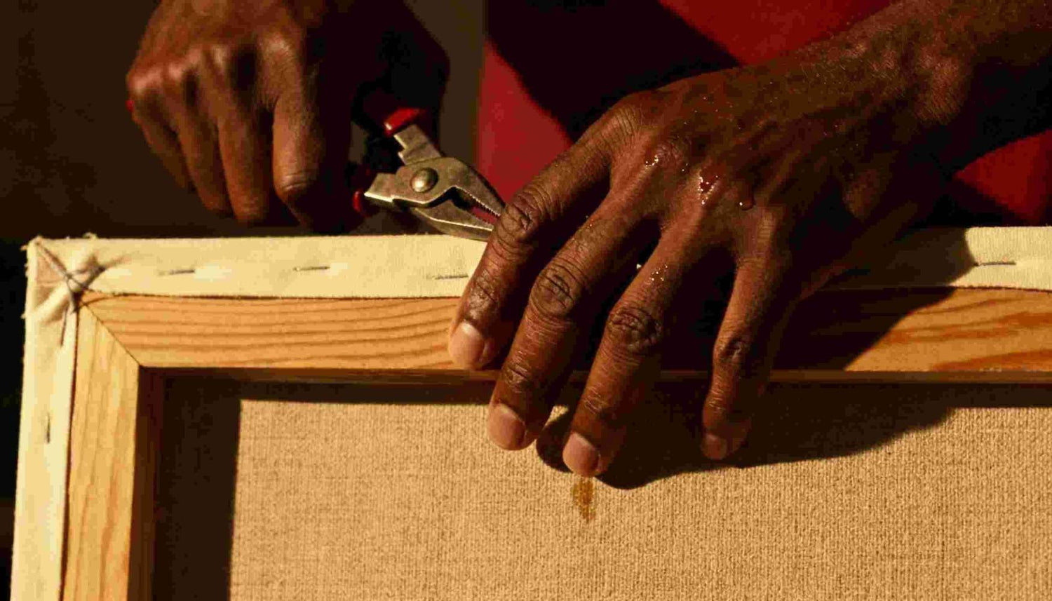 Man framing art work