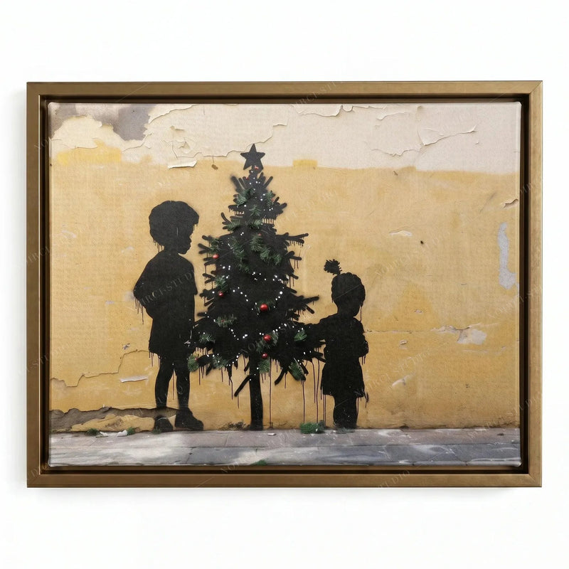 Black holiday wall art in a gold floating frame, stencil children with a star-topped tree on yellow plaster