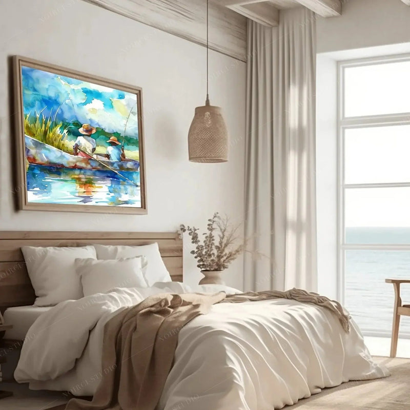 Coastal bedroom art, framed watercolor of boys fishing beside linen bedding, a rattan pendant and an ocean view