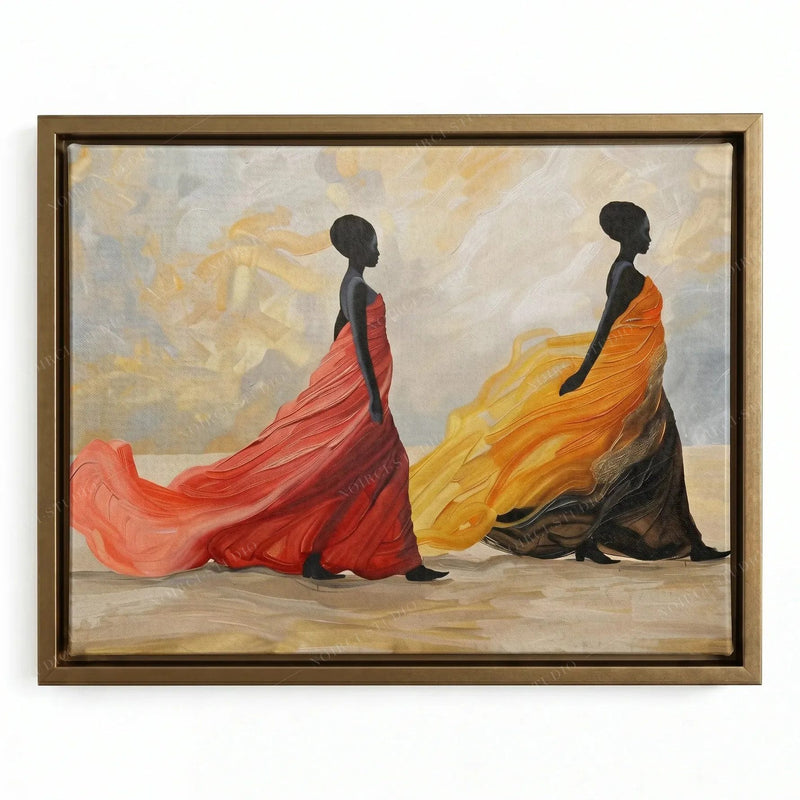 African canvas wall art in a gold floating frame, two regal women with trailing sunset-colored fabric