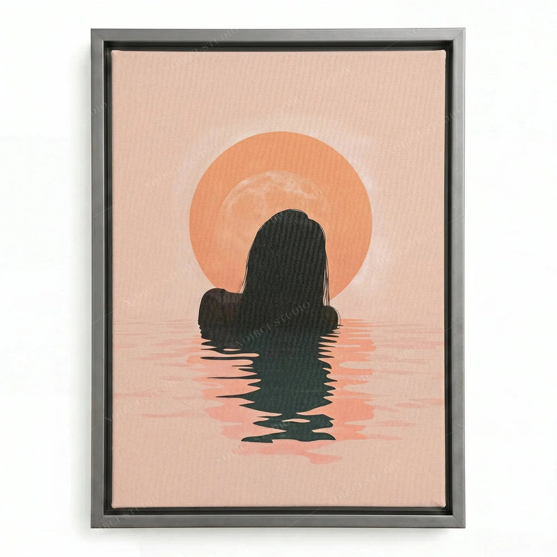 Minimalist Black art in a silver floating frame, woman wading toward the sunrise across rippled pink water