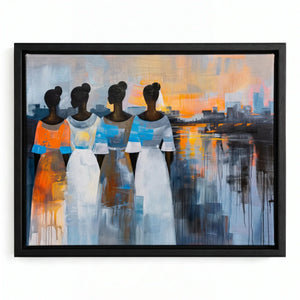 Modern African tribal art in a black floating frame, four women in white and blue dresses facing a waterfront sunset