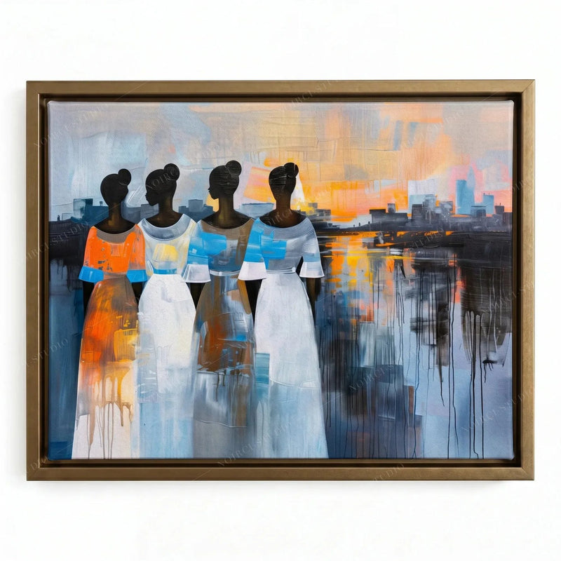 African wall decor in a gold floating frame, four Black women in flowing dresses, city skyline mirrored in the water