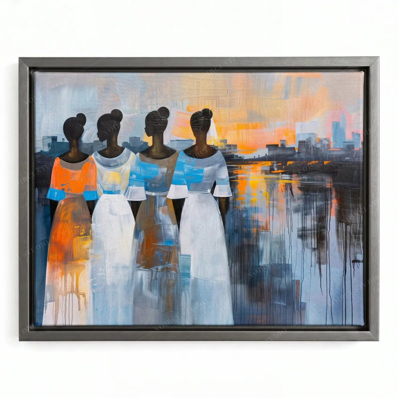 Four Black women in orange, white and blue dresses, silver floating frame, sunset reflections, African canvas wall art
