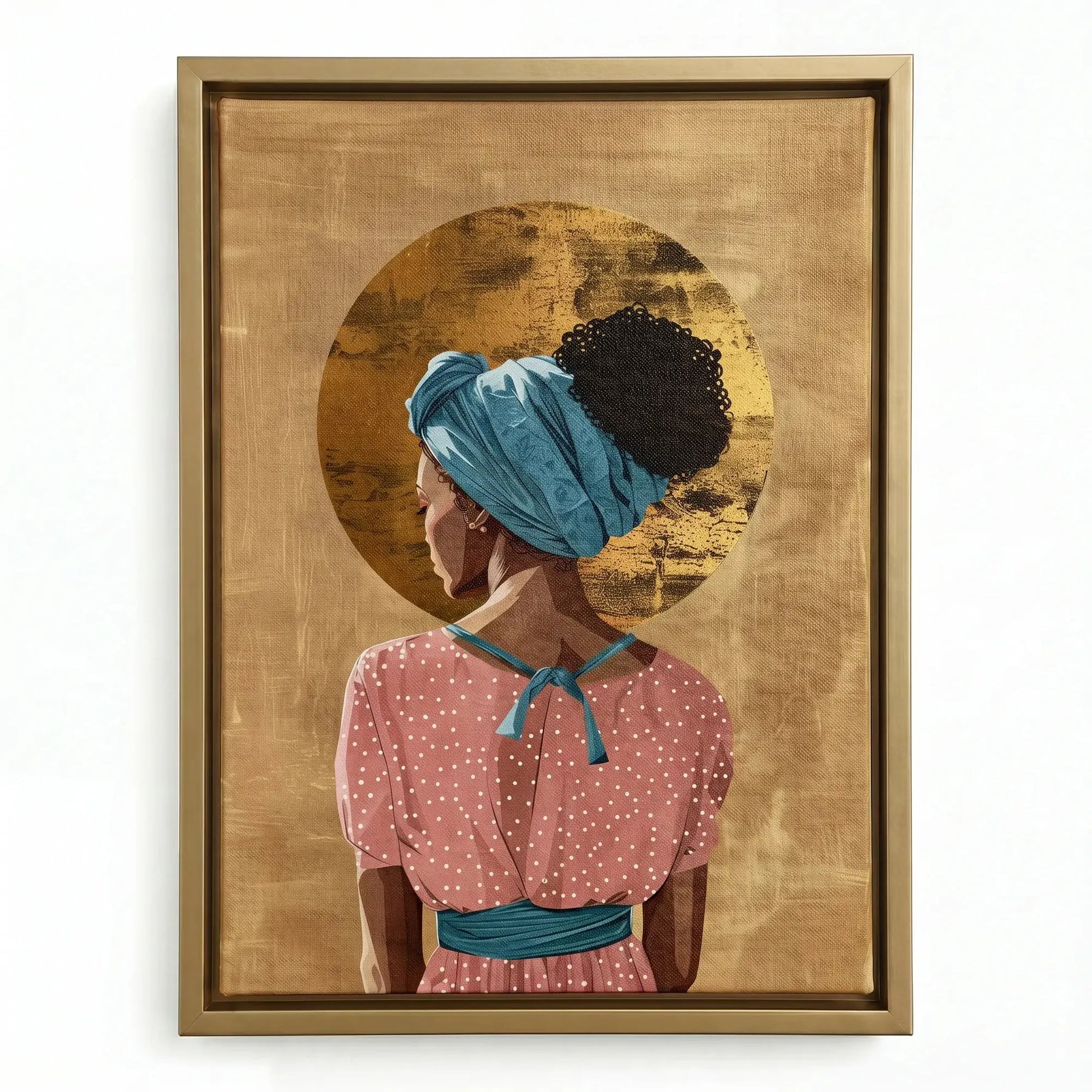 Black boho wall decor in a gold floating frame, woman in a pink dot dress and teal sash with a gold leaf halo