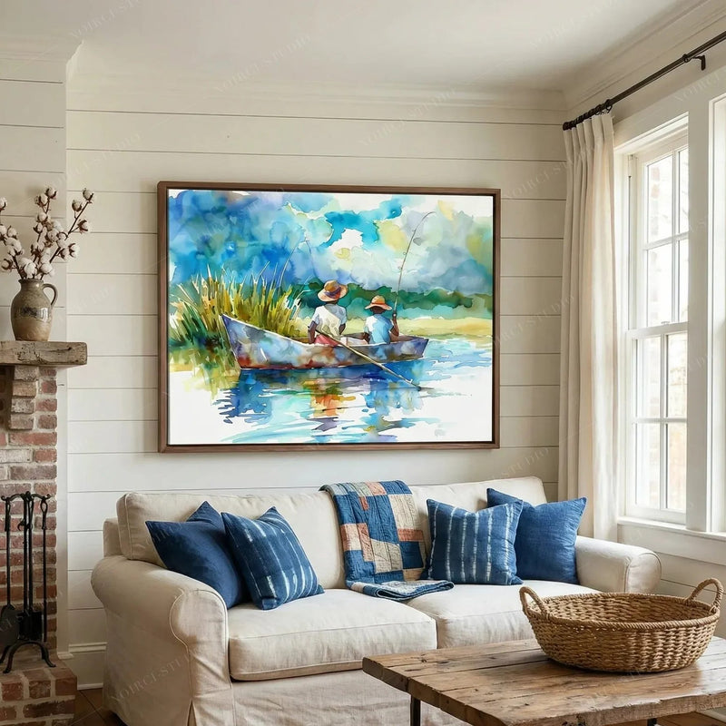 Black art for living room walls, boys fishing watercolor above a white sofa with indigo pillows and a shiplap fireplace