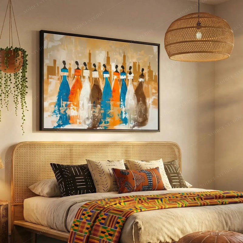 Ancestors Afrocentric canvas wall art in a black frame in a boho bedroom with cane headboard and kente throw