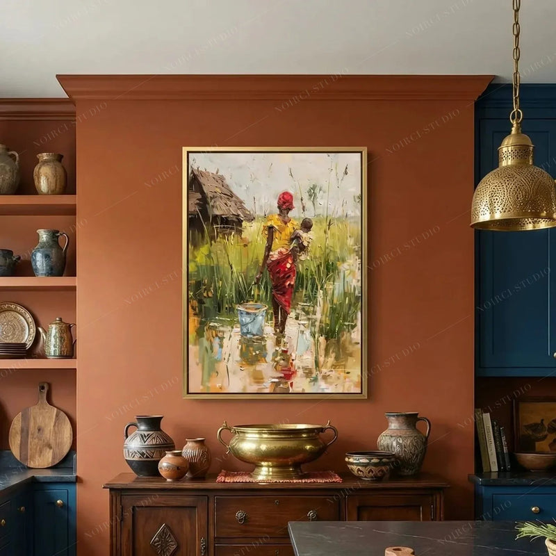 Black kitchen wall art, mother and child village scene on a terracotta wall above a dark wood sideboard