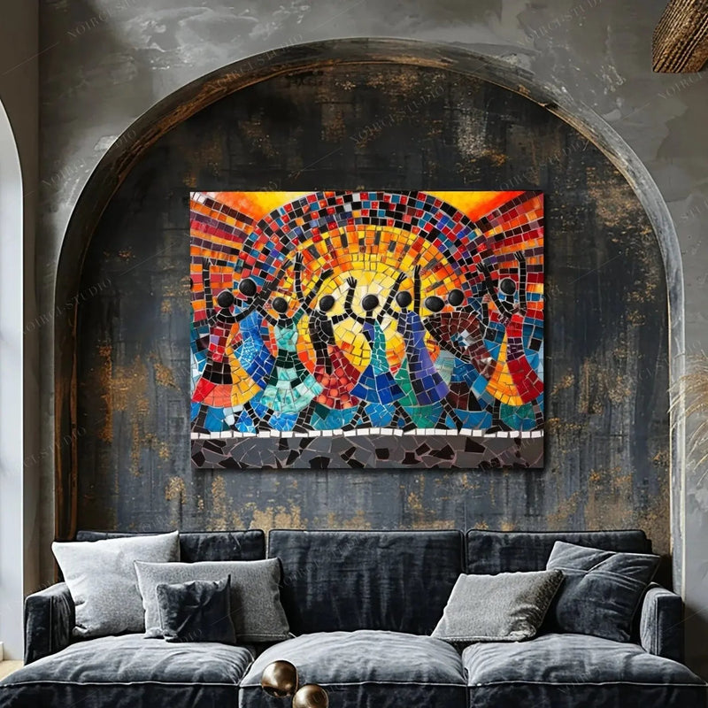 African American art for the wall, mosaic sun dancers in a gray arched alcove above a charcoal velvet sofa