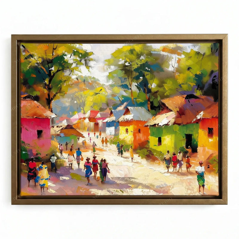 African wall decor in a gold floating frame, sun-dappled village street lined with pink, green and orange houses