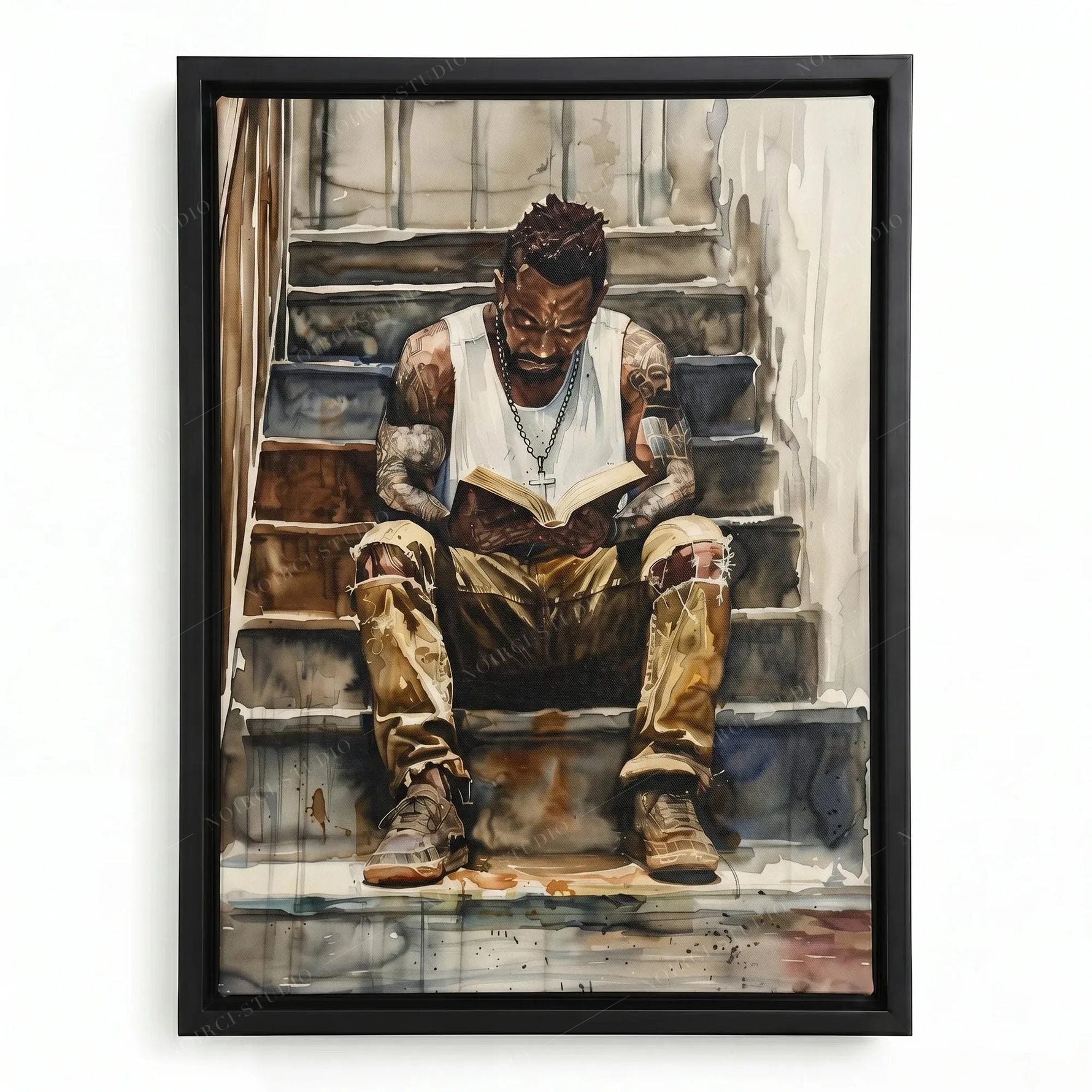 Black man reading painting in a black floating frame, tattooed man in a white tank top with a book on concrete stairs