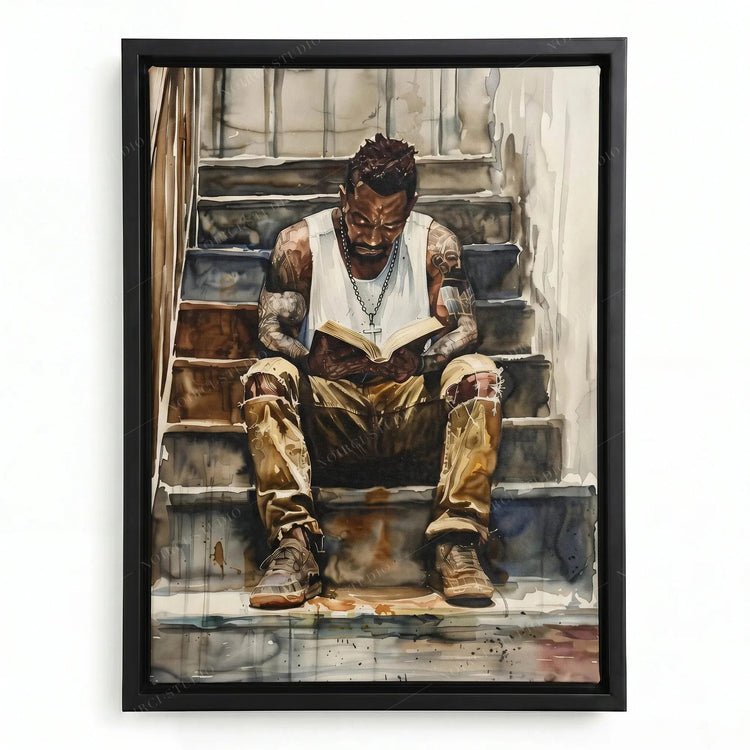 Black man reading painting in a black floating frame, tattooed man in a white tank top with a book on concrete stairs