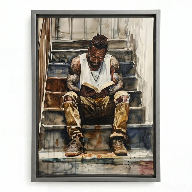 Watercolor portrait of a Black man reading a book on stairs, shown in a silver floating frame