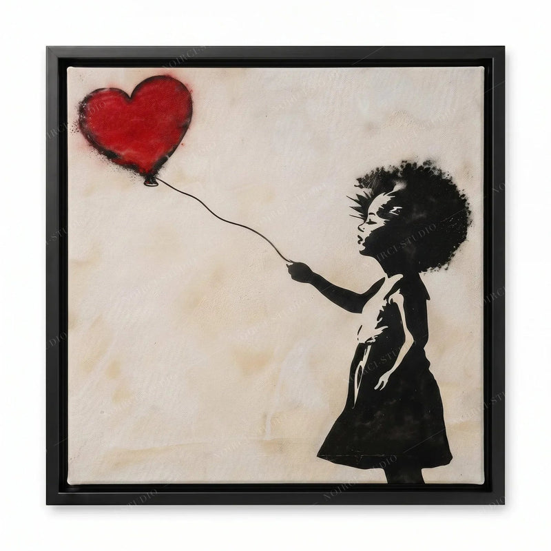 Banksy-style Black girl art in a black floating frame, stencil of a girl reaching for a heart balloon