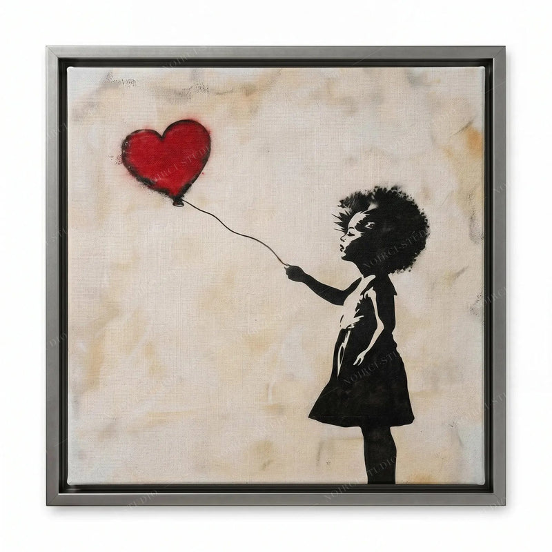 Street art canvas in a silver floating frame, silhouetted girl in a dress releasing a red heart balloon