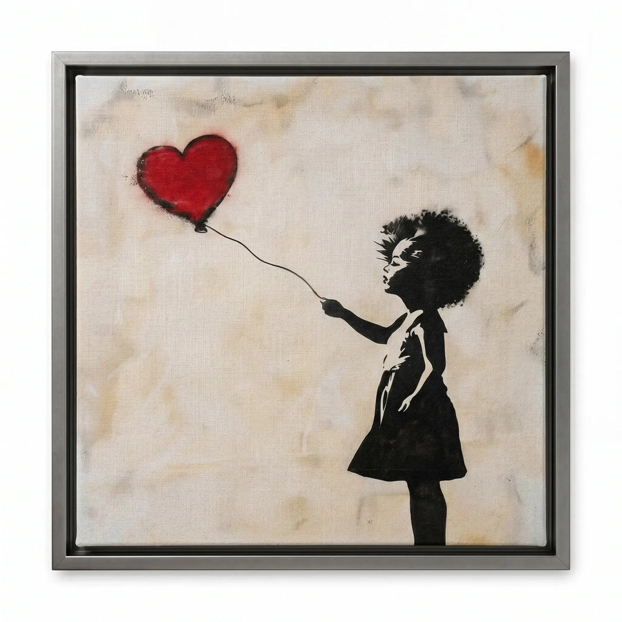 Street art canvas in a silver floating frame, silhouetted girl in a dress releasing a red heart balloon