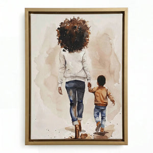Black family artwork in a gold floating frame, watercolor of a mother and small son in a caramel jacket walking together