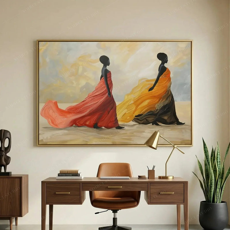 African American art for a home office, gold framed silhouettes above a walnut desk with brass lamp and leather chair