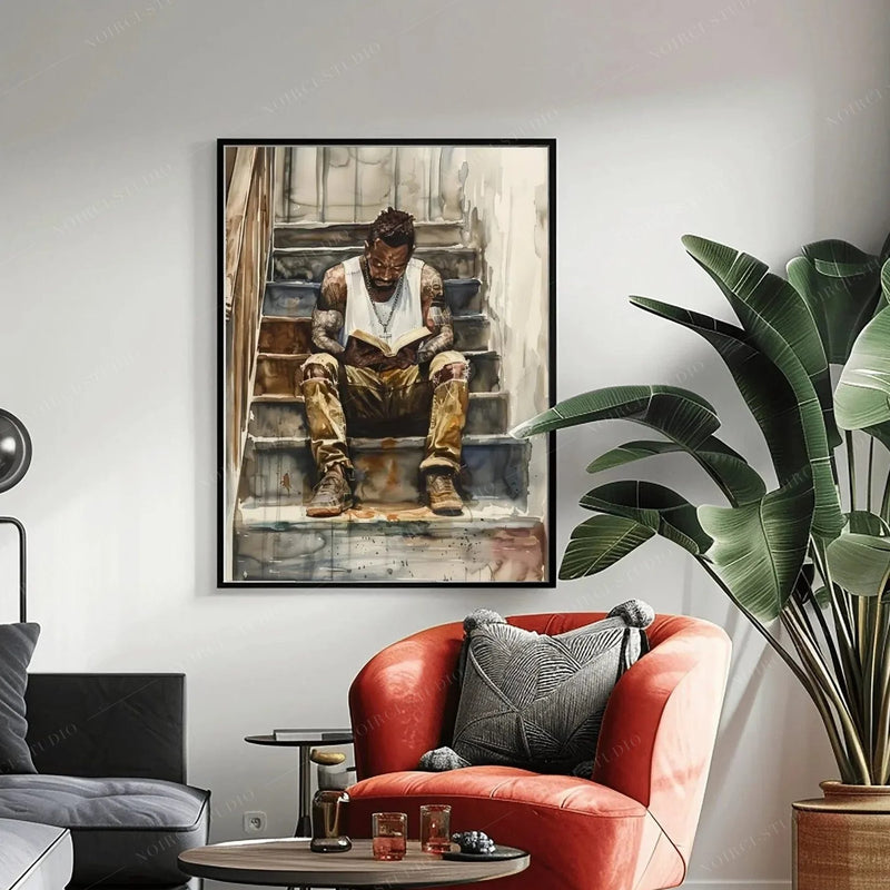 African American art above a coral armchair and bird of paradise plant, black-framed watercolor of a man reading