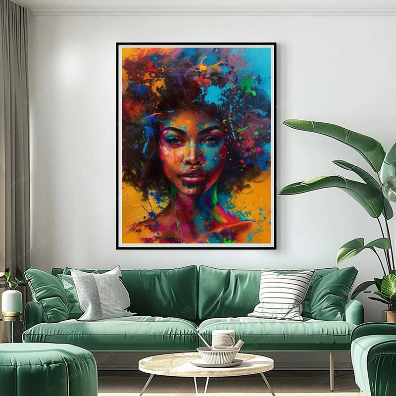 Black art for living room, neon splash-paint woman portrait in a black frame above a sage green velvet sofa