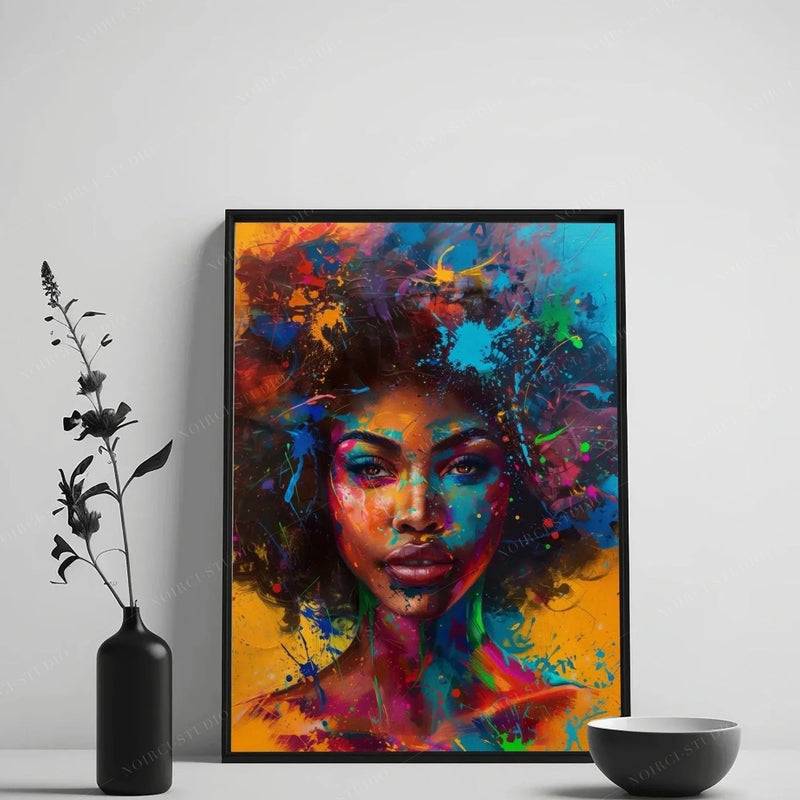 Afrofuturism wall art in a black frame on a white wall, styled with a black vase of dried stems and a ceramic bowl