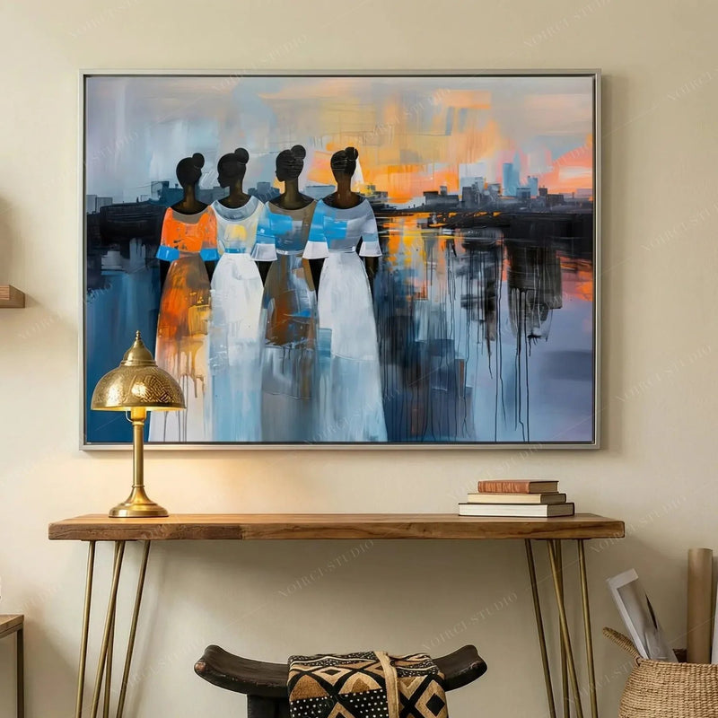 Modern Black art for apartment, silver framed sunset painting above a walnut hairpin console with a brass lamp
