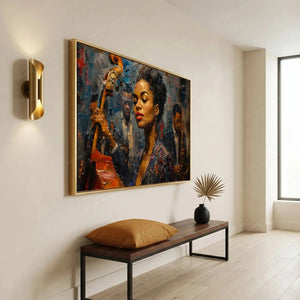 Modern Black art for an apartment entryway, gold framed jazz portrait above a bench with a camel pillow