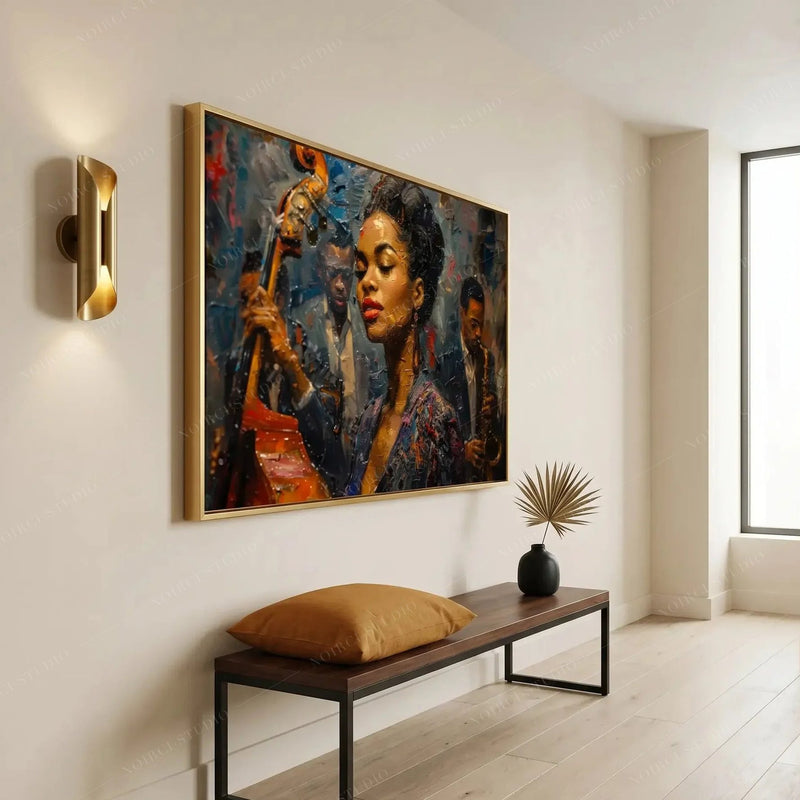 Modern Black art for an apartment entryway, gold framed jazz portrait above a bench with a camel pillow