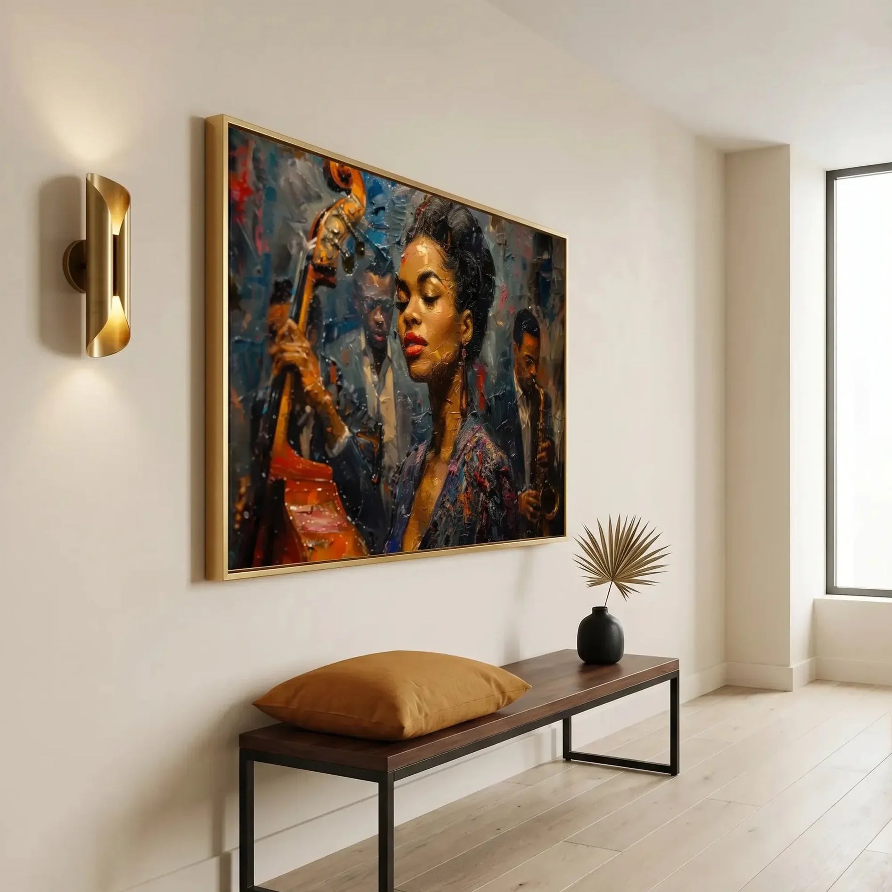Modern Black art for an apartment entryway, gold framed jazz portrait above a bench with a camel pillow
