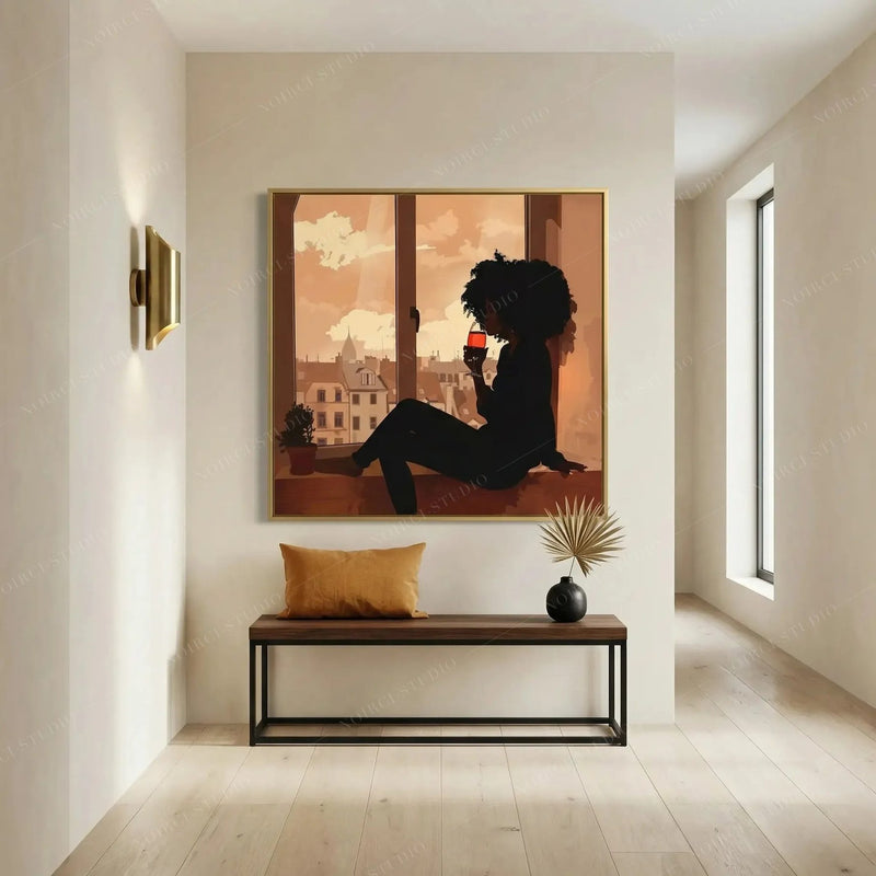 Modern Black art for apartment, gold framed woman and wine print above a bench with mustard pillow and dried palm